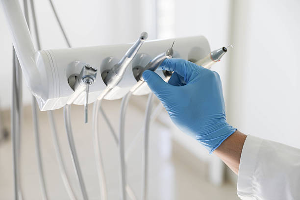 Professional Tooth Extraction technician working in Bentonville, AR
